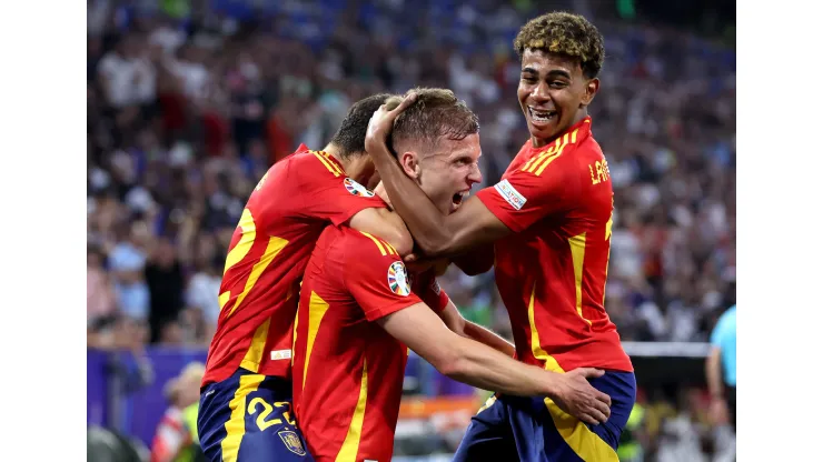 MUNICH, GERMANY &#8211; JULY 09: Dani Olmo of Spain celebrates scoring his team's second goal with teammate Lamine Yamal during the UEFA EURO 2024 Semi-Final match between Spain and France at Munich Football Arena on July 09, 2024 in Munich, Germany. (Photo by Alex Livesey/Getty Images)
