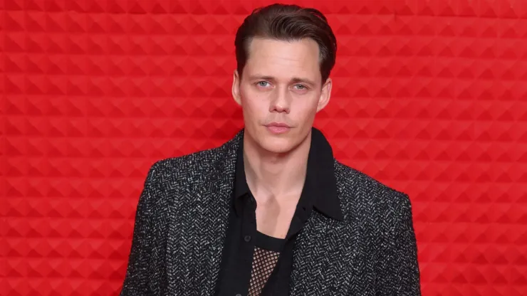 Bill Skarsgård attends the H&M&Milan event dressed in the upcoming H&M Atelier collection during the Milan Fashion Week Spring / Summer 2025.
