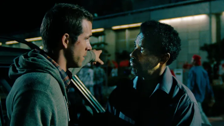 Denzel Washington and Ryan Reynolds in Safe House.
