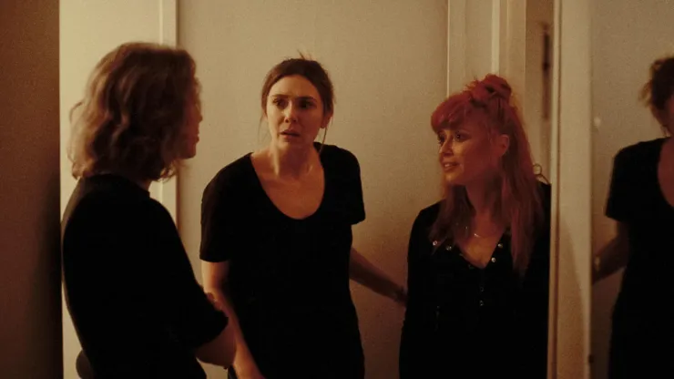 Natasha Lyonne, Elizabeth Olsen and Carrie Coon in His Three Daughters.
