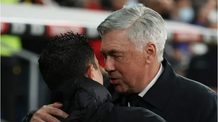 Carlo Ancelotti (R) of Real Madrid and Xavi Hernandez (L) of FC Barcelona  (Photo by Gonzalo Arroyo Moreno/Getty Images)
