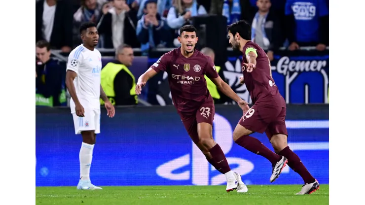 BRATISLAVA, SLOVAKIA - OCTOBER 01: Ilkay Guendogan of Manchester City celebrates scoring his team's first goal with teammate Matheus Nunes during the UEFA Champions League 2024/25 League Phase MD2 match between SK Slovan Bratislava and Manchester City at Tehelne Pole on October 01, 2024 in Bratislava, Slovakia. (Photo by Christian Bruna/Getty Images)
