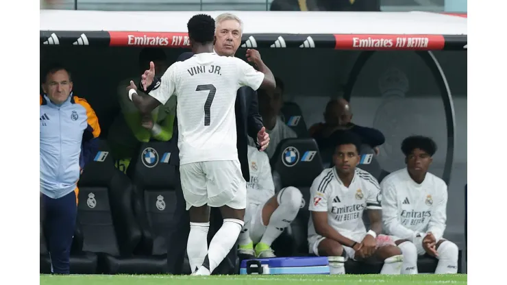 MADRID, SPAIN - NOVEMBER 09: Vinicius Junior (L) of Real Madrid CF celebrates scoring their opening goal with his coach Carlo Ancelotti (R) during the LaLiga match between Real Madrid CF and CA Osasuna at Estadio Santiago Bernabeu on November 09, 2024 in Madrid, Spain. (Photo by Gonzalo Arroyo Moreno/Getty Images)
