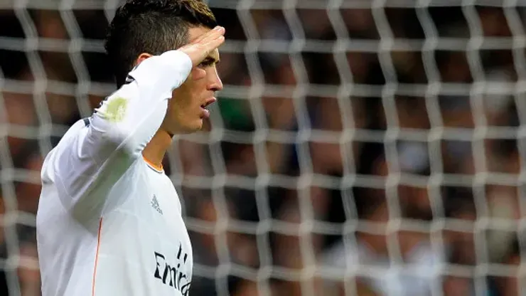 Real Madrid's Portuguese forward Cristiano Ronaldo gestures as he celebrates after scoring a penalty kick during the Spanish league football match Real Madrid CF vs Sevilla FC at the Santiago Bernabeu stadium in Madrid on October 30, 2013. AFP PHOTO / GERARD JULIEN (Photo credit should read GERARD JULIEN/AFP/Getty Images)
