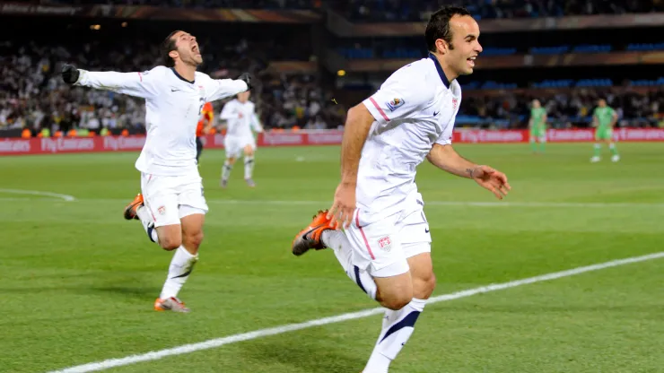 Landon Donovan of USA celebrates the winning goal with team mates
