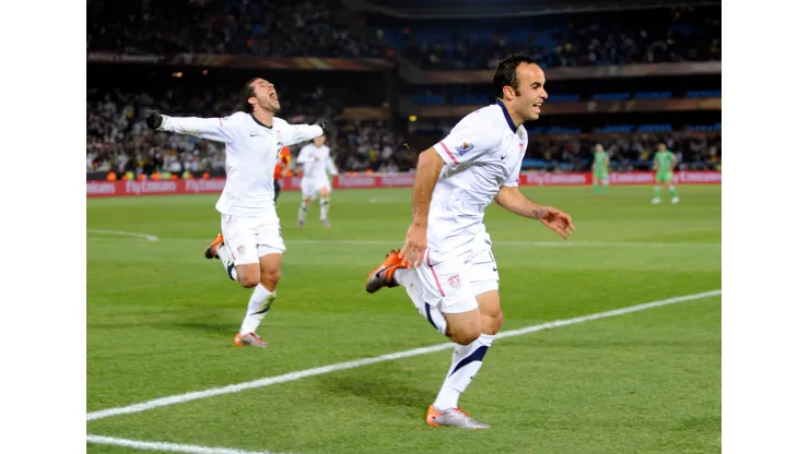 Landon Donovan of USA celebrates the winning goal with team mates
