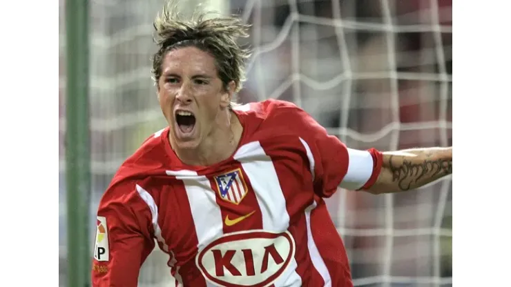Atletico de Madrid's Fernando Torres, left celebrates with his team mate Mateja Kezman of Serbia – Montenegro after Torres scored against Barcelona during a Spanish league soccer match at the Vicente Calderon stadium in Madrid Sunday Sept. 18, 2005. (AP Photo/Paul White)
