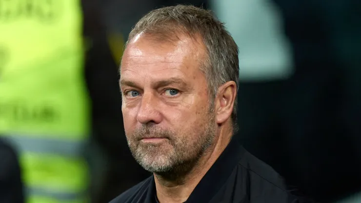 Hansi Flick, Head Coach of FC Barcelona, looks on prior to the LaLiga match between Real Madrid CF and FC Barcelona at Estadio Santiago Bernabeu on October 26, 2024 in Madrid, Spain. 
