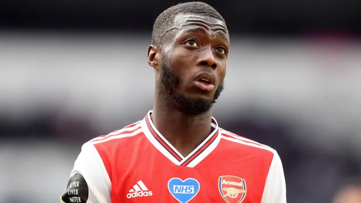 Nicolas Pepe of Arsenal reacts during the Premier League match between Tottenham Hotspur and Arsenal FC at Tottenham Hotspur Stadium on July 12, 2020 in London, England. 
