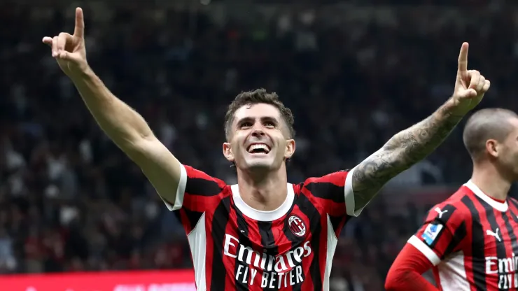 Christian Pulisic of AC Milan celebrates scoring his team's third goal during the Serie A match between AC Milan and Lecce at Stadio Giuseppe Meazza on September 27, 2024 in Milan, Italy. 
