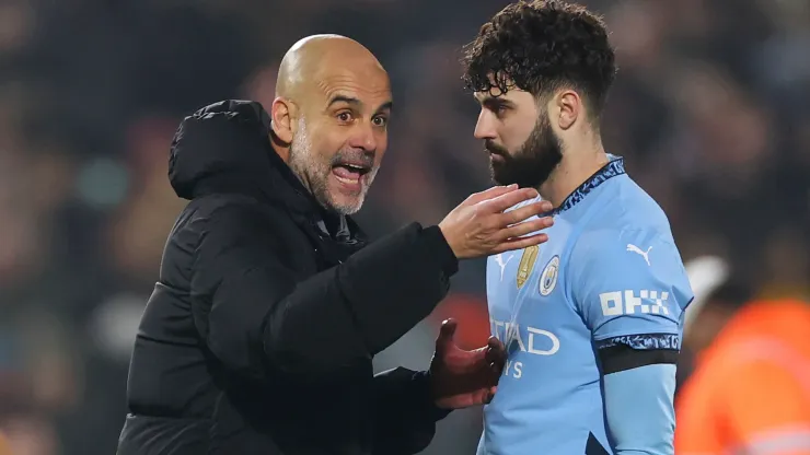 Pep Guardiola, Manager of Manchester City, interacts with Josko Gvardiol of Manchester City at full-time following the team's draw in the Premier League match between Brentford FC and Manchester City FC at Gtech Community Stadium on January 14, 2025 in Brentford, England. 
