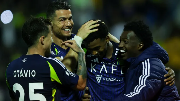 Cristiano Ronaldo of Al Nassr celebrates with teammate Saad Hagawi after scoring the 3rd goal during the Saudi Pro League match between Al Khaleej and Al Nassr at Prince Mohammed bin Fahad Stadium in Dammam on January 21, 2025 in Dammam, Saudi Arabia.
