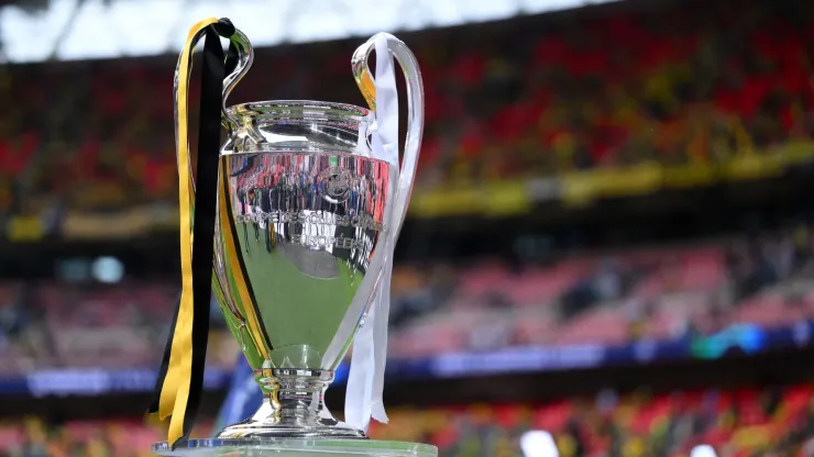 A detailed view of the UEFA Champions League Trophy, dressed in yellow and black ribbons to represent Borussia Dortmund and white ribbons to represent Real Madrid, on a plinth on the inside of the stadium prior to the UEFA Champions League 2023/24 Final match between Borussia Dortmund and Real Madrid CF at Wembley Stadium on June 01, 2024 in London, England.
