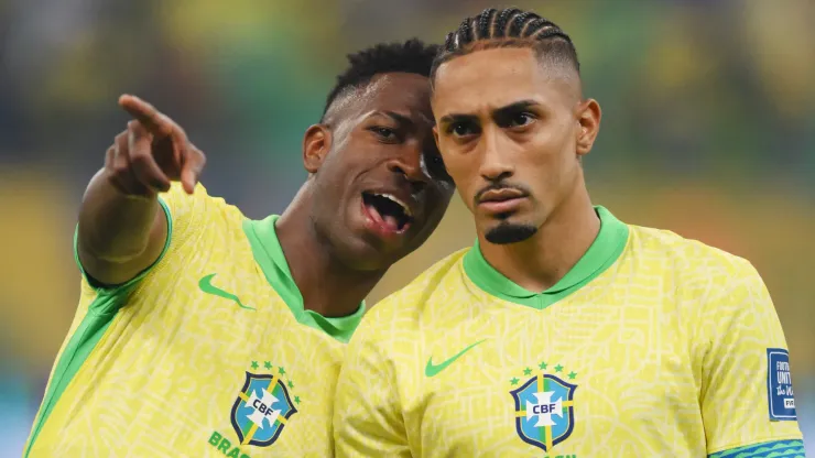 Vinicius Junior and Raphinha of Brazil talk as they line up prior to the South American FIFA World Cup 2026 Qualifier match between Brazil and Uruguay at Arena Fonte Nova on November 19, 2024 in Salvador, Brazil.
