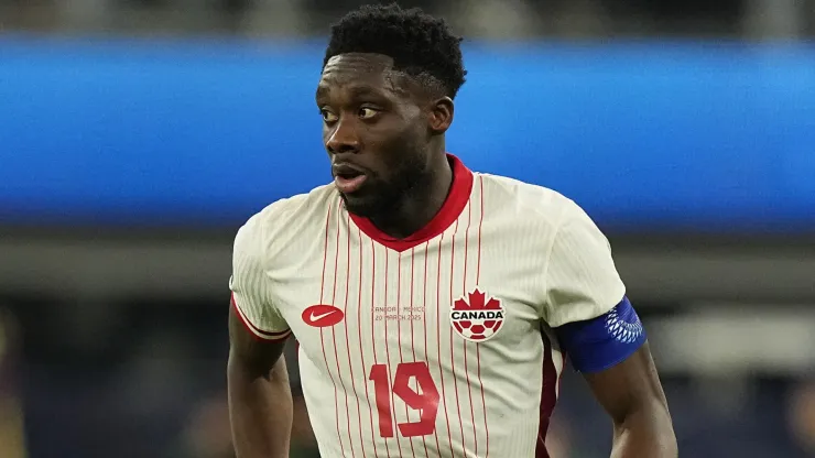 Alphonso Davies #19 of Canada controls the ball against Mexico during the first half of a CONCACAF Nations League semifinal match at SoFi Stadium on March 20, 2025 in Inglewood, California.
