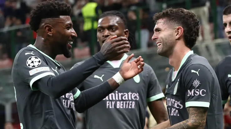Christian Pulisic of AC Milan celebrates after scoring the opening goal with his team-mate Emerson Royal during the UEFA Champions League 2024/25 League Phase MD3 match between AC Milan and Club Brugge KV at Stadio San Siro on October 22, 2024 in Milan, Italy

