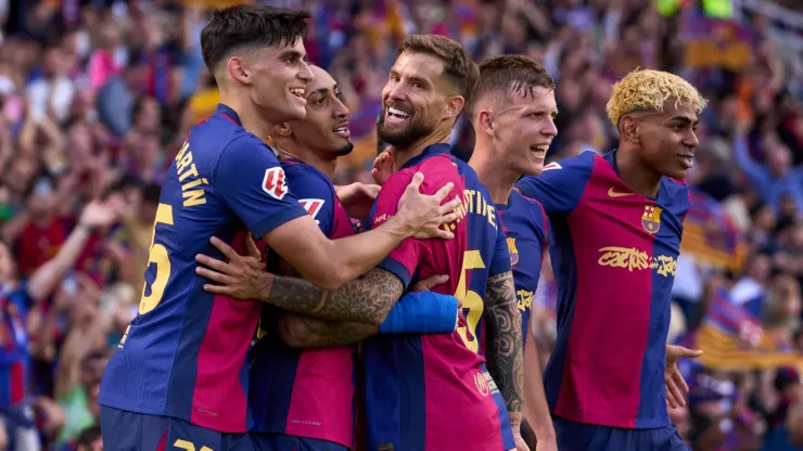 Raphinha (2nd L) of FC Barcelona celebrates with his teammates Gerard Martin, Inigo Martinez, Dani Olmo and Lamine Yamal after scoring their team's fourth goal during the LaLiga match between FC Barcelona and Real Madrid CF at Estadi Olimpic Lluis Companys on May 11, 2025 in Barcelona, Spain.
