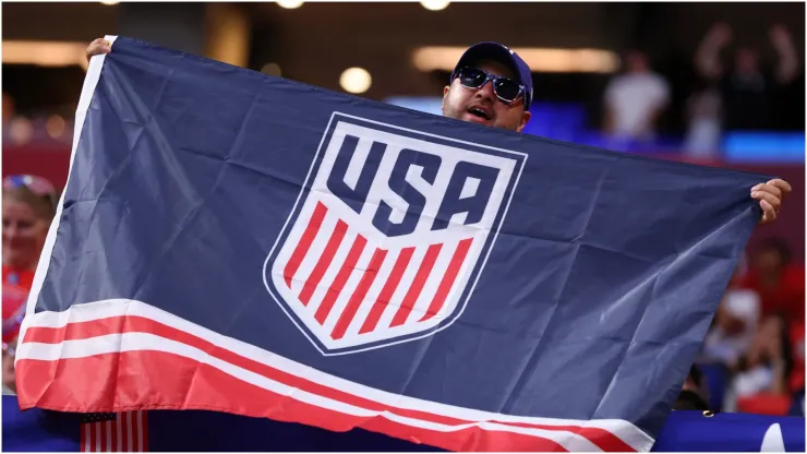 USA fan of United States cheers with a flag
