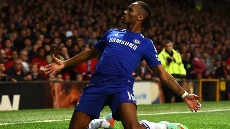 Didier Drogba of Chelsea celebrates scoring the first goal during the Barclays Premier League match between Manchester United and Chelsea at Old Trafford on October 26, 2014 in Manchester, England.

