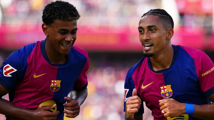 Raphinha of FC Barcelona celebrates scoring his team's first goal with team mate Lamine Yamal during the La Liga match between FC Barcelona and Real Valladolid CF at Camp Nou on August 31, 2024 in Barcelona, Spain. 

