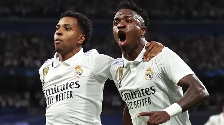 Vinicius Junior and Rodrygo Goes celebrate after Real Madrid's goal vs. Manchester City in a 2023 Champions League match.
