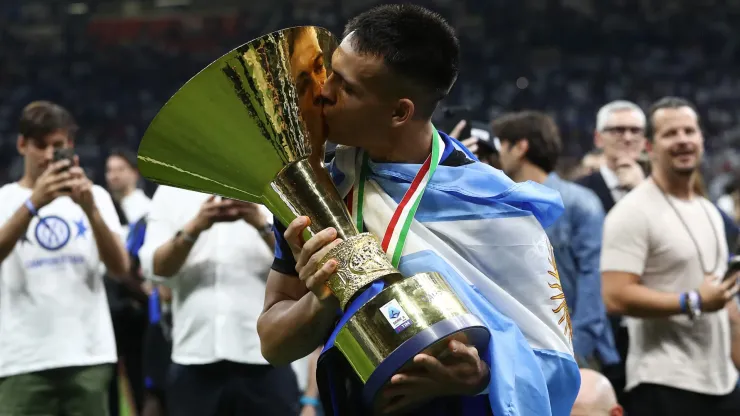 Lautaro Martinez of FC Internazionale kisses the Serie A TIM Scudetto title trophy at full-time following the team's draw in the Serie A TIM match between FC Internazionale and SS Lazio in 2024.
