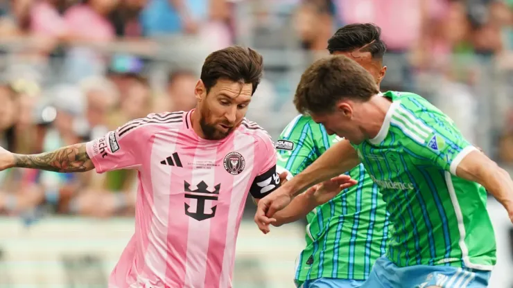 Lionel Messi #10 of Inter Miami CF is challenged by Reed Baker-Whiting #21 of the Seattle Sounders FC during the Leagues Cup Final.
