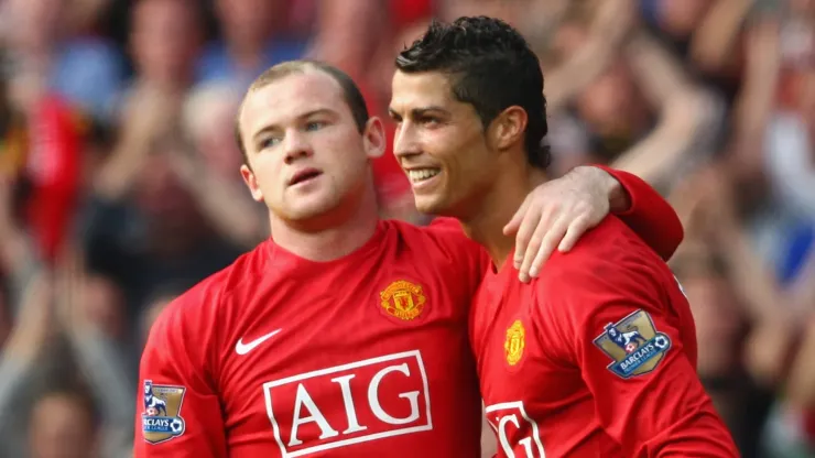 Cristiano Ronaldo and Wayne Rooney playing for Manchester United.
