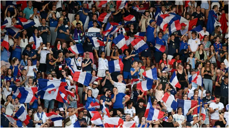 Fans of France wave their national flag