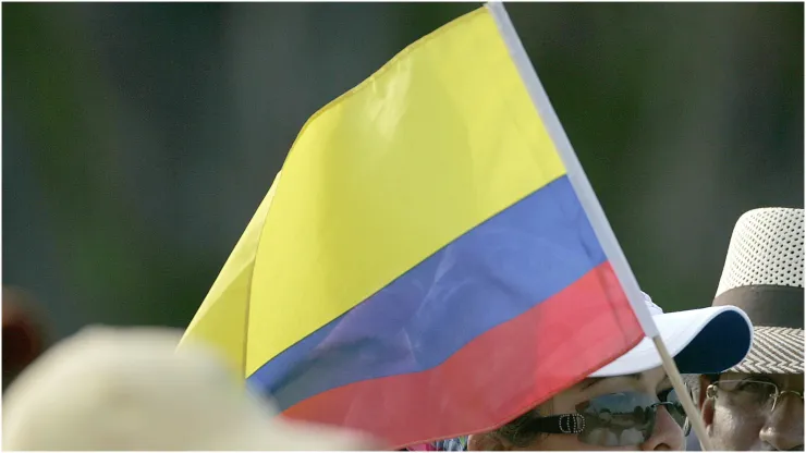 A fan waves a Colombian flag
