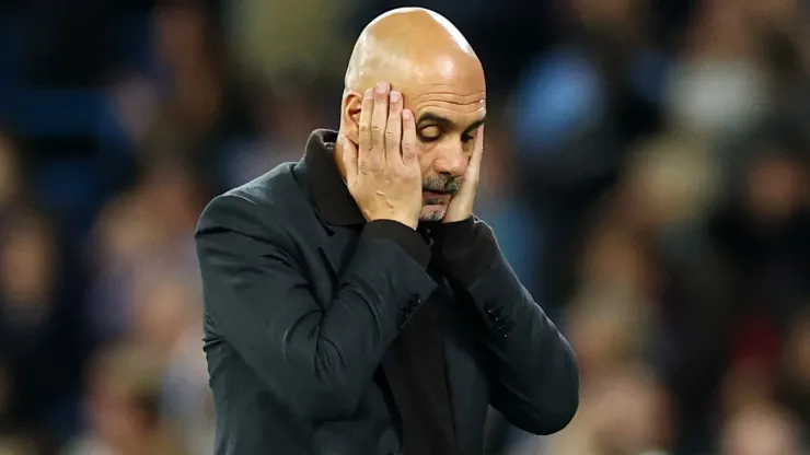 Pep Guardiola, Manager of Manchester City, reacting in a game.
