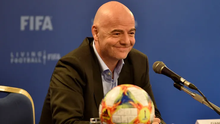 President of FIFA Gianni Infantino smiling in a conference. 
