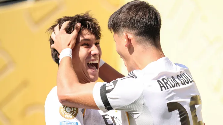 Gonzalo Garcia #30 and Arda Gueler #15 of Real Madrid celebrating a goal.
