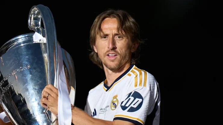 Luka Modric of Real Madrid celebrates with the UEFA Champions League trophy in 2024.