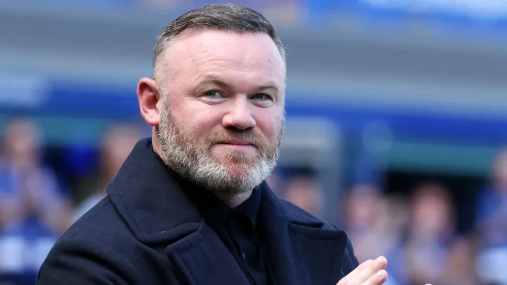 Manchester United legend Wayne Rooney acknowledges the fans following the Premier League match.
