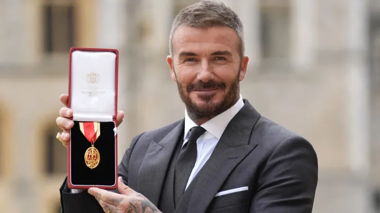 Sir David Beckham poses after he was made a Knight Bachelor.