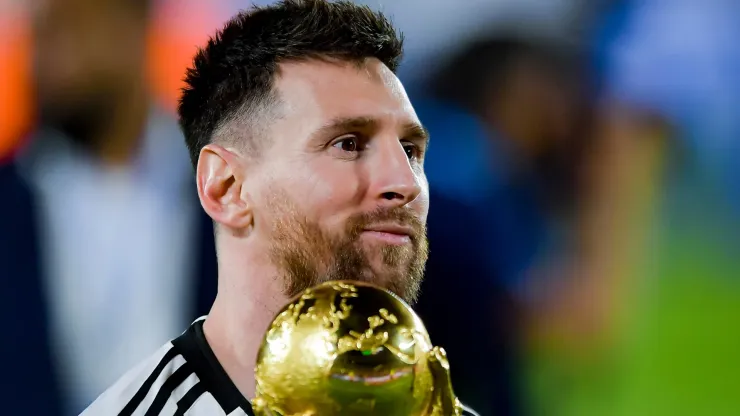 Lionel Messi of Argentina holds the FIFA World Cup trophy.
