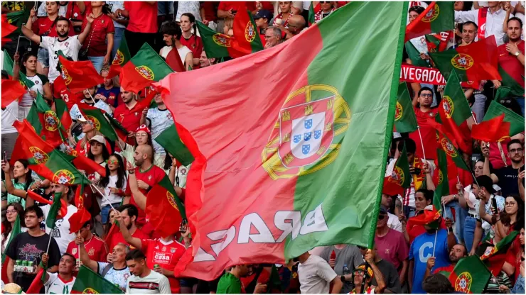 Fans of Portugal wave their national flag
