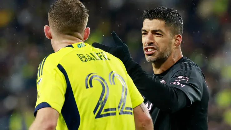 Luis Suarez #9 of Inter Miami CF clashes with Josh Bauer #22 of Nashville SC
