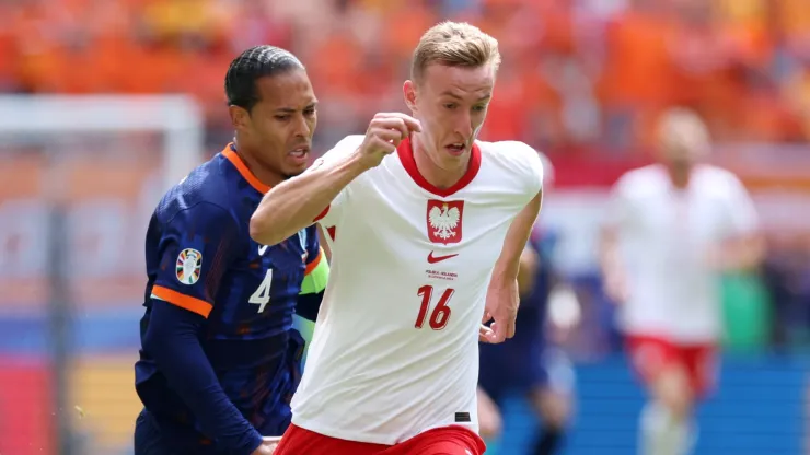 Adam Buksa of Poland runs with the ball.
