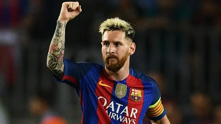 Lionel Messi celebrates scoring a goal during a UEFA Champions League game with Barcelona in 2016. 
