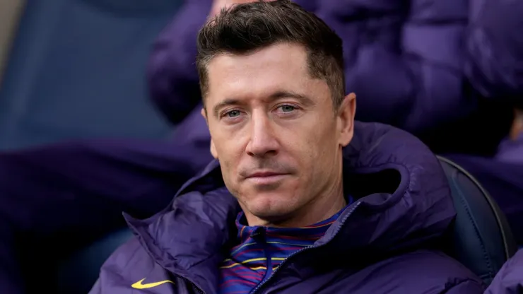 Robert Lewandowski of FC Barcelona looks on from the bench.
