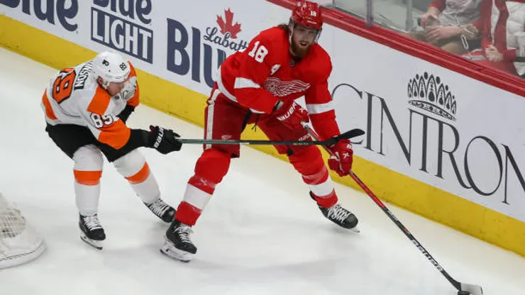 DETROIT, MI - MARCH 22: Detroit Red Wings defenseman Marc Staal (18) skates with the puck against Philadelphia Flyers forward Cam Atkinson (89) during the first period of a regular season NHL hockey game between the Philadelphia Flyers and the Detroit Red Wings on March 22, 2022 at Little Caesars Arena in Detroit, Michigan. (Photo by Scott W. Grau/Icon Sportswire via Getty Images)