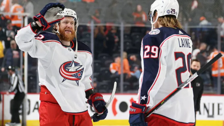 PHILADELPHIA, PA - APRIL 05: Jakub Voracek #93 and Patrik Laine #29 of the Columbus Blue Jackets celebrate after defeating the Philadelphia Flyers 4-2 at the Wells Fargo Center on April 5, 2022 in Philadelphia, Pennsylvania. (Photo by Len Redkoles/NHLI via Getty Images)