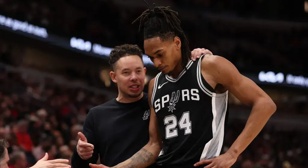 Interim head coach Mitchell Johnson of the San Antonio Spurs talks with Devin Vassell #24 against the Chicago Bulls during the second half at the United Center on January 06, 2025 in Chicago, Illinois.