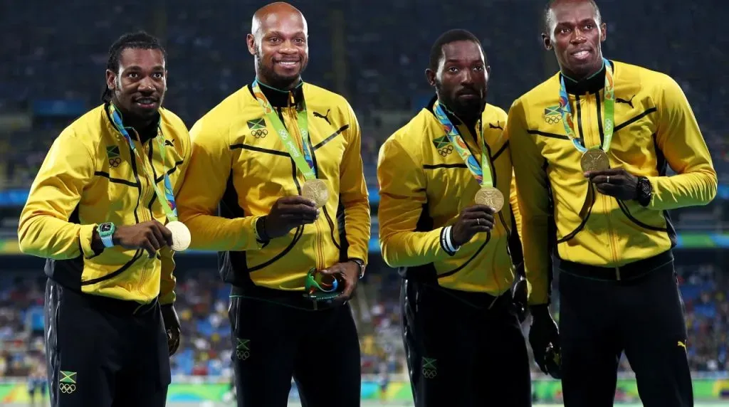 RIO DE JANEIRO, BRAZIL – AUGUST 20:  Gold medalists Asafa Powell, Yohan Blake, Nickel Ashmeade and Usain Bolt of Jamaica stand on the podium during the medal ceremony for the Men’s 4 x 100 meter Relay on Day 15 of the Rio 2016 Olympic Games at the Olympic Stadium on August 20, 2016 in Rio de Janeiro, Brazil.