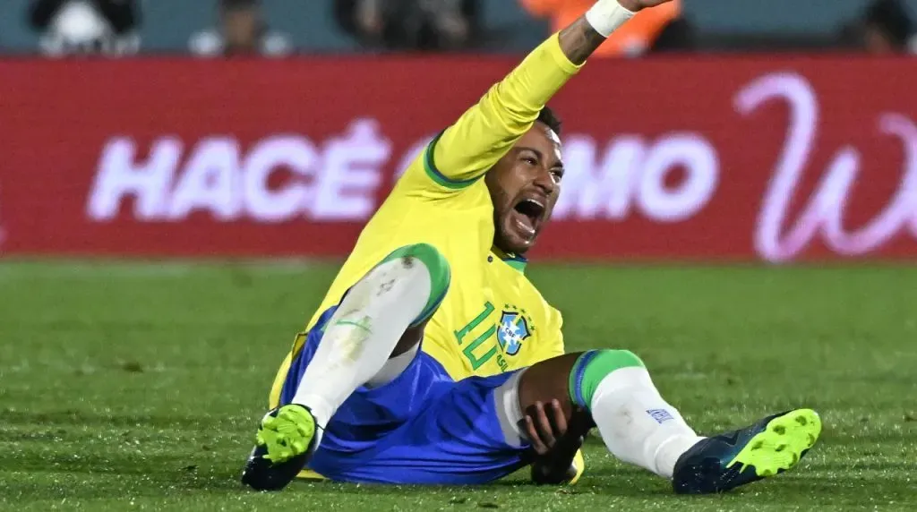 Neymar Jr. of Brazil reacts after being injured