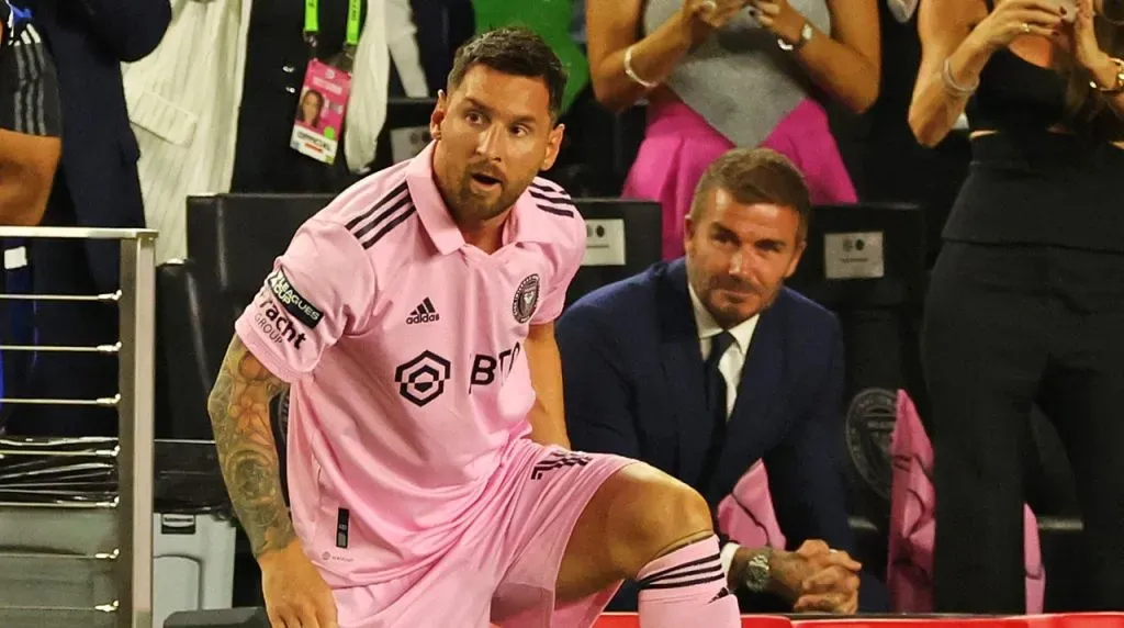 David Beckham watches Lionel Messi
