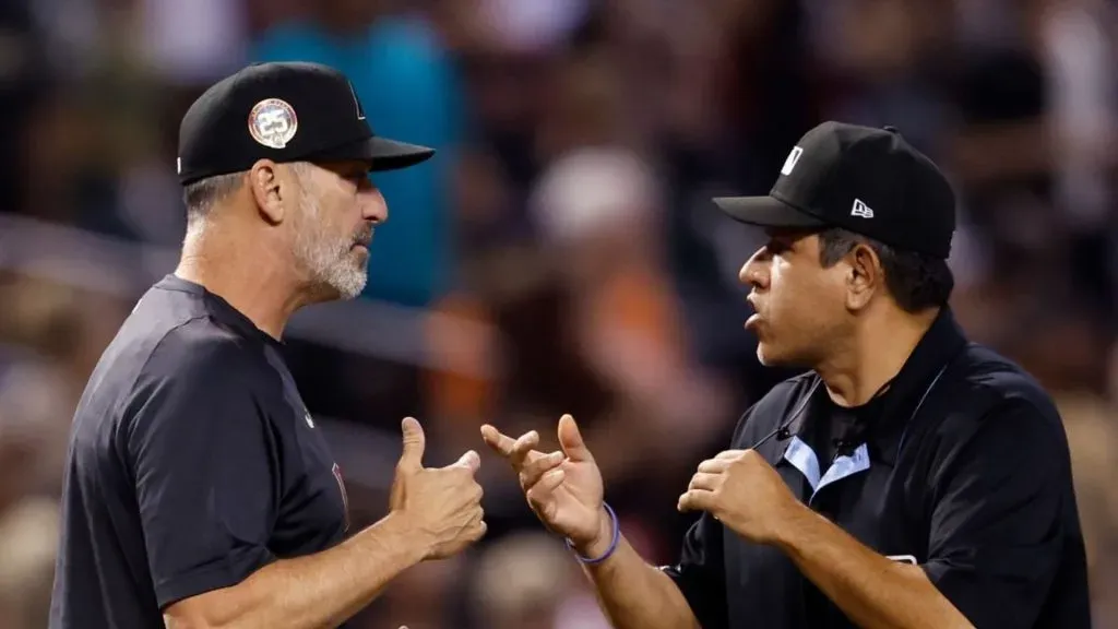 Manager Torey Lovullo #17 of the Arizona Diamondbacks challenges a call on Dominic Fletcher’s home run with umpire Alfonso Marquez