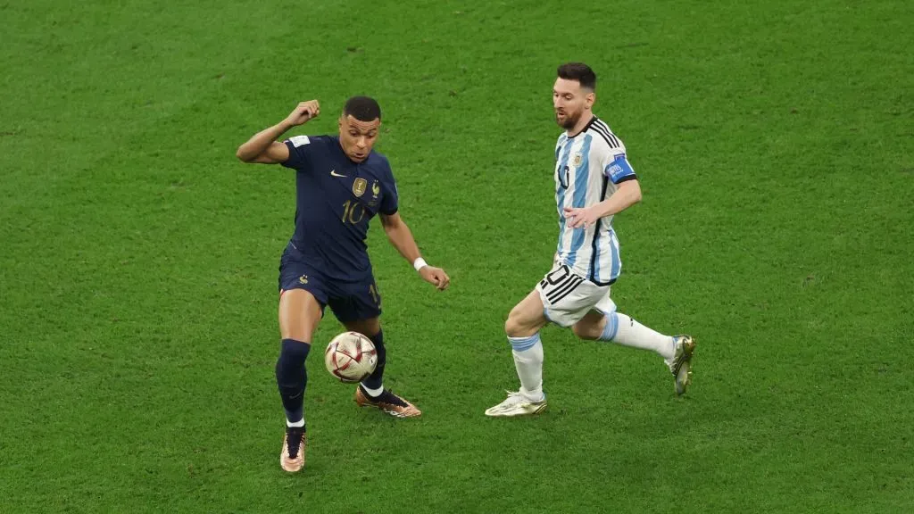 Kylian Mbappe controls the ball against Lionel Messi during the FIFA World Cup Qatar 2022 Final match between Argentina and France at Lusail Stadium on December 18, 2022 in Lusail City, Qatar.